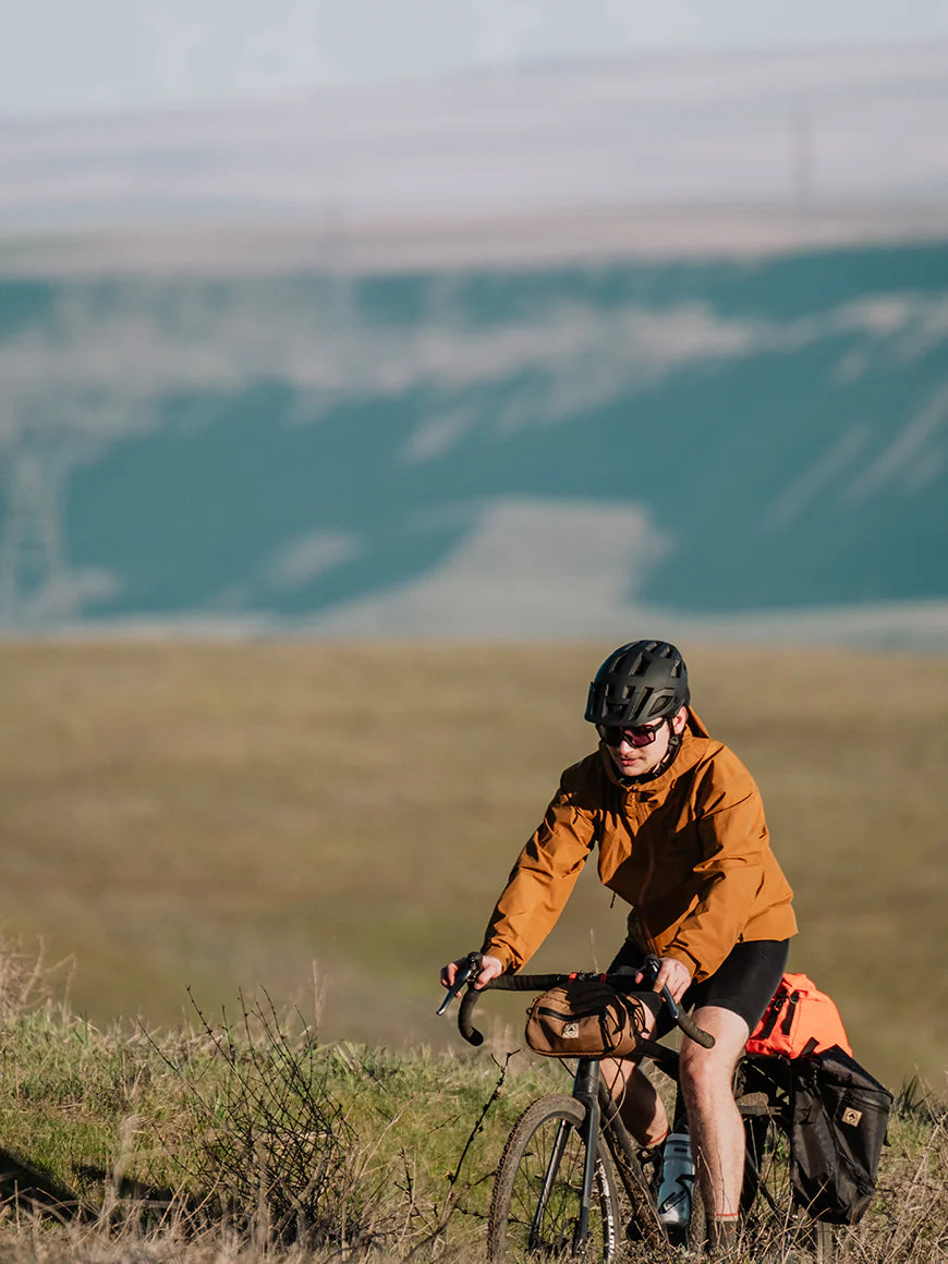 Cyclist on a hillside with Bikepacking 澳洲5结果记录 bags. - North St Bags all-groups